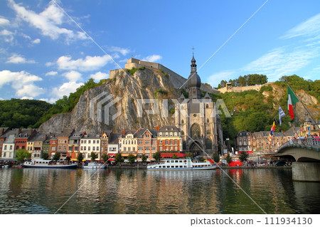 Dinant, a city in the Walloon region of Namur, Belgium in Western Europe, view of Notre Dame church and Citadelle fortress 111934130