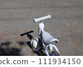 A stylish white tricycle in the park 111934150