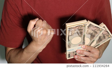 person holding a lot of money and posing 111934264