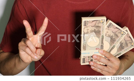 person holding a lot of money and posing 111934265