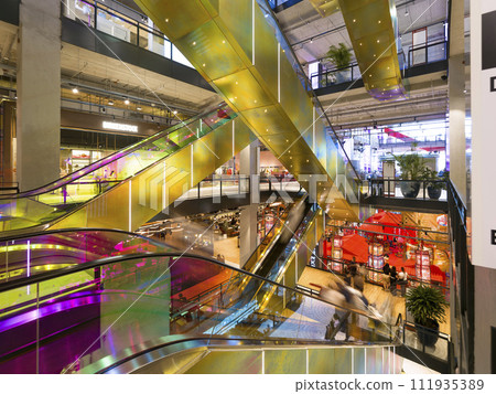 Escalator in the atrium of a shopping mall / Bangkok, Thailand Escalator in the atrium of a shopping mall / Bangkok, Thailand 111935389
