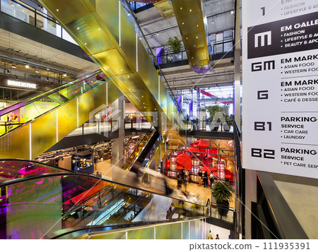 Escalator in the atrium of a shopping mall / Bangkok, Thailand Escalator in the atrium of a shopping mall / Bangkok, Thailand 111935391