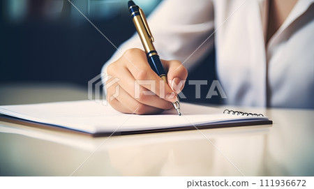 woman hand writing on a pen woman hand writing on a pen 111936672
