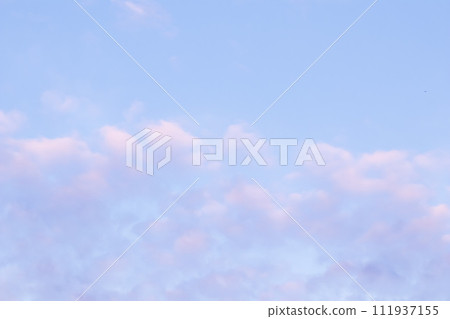 Background of blue sky with pale pink clouds in sunset Background of blue sky with pale pink clouds in sunset 111937155