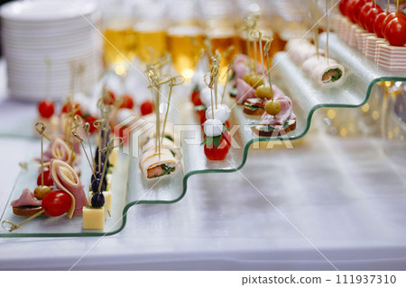 Assorted Gourmet Canapes on Glass Serving Tray. Assorted Gourmet Canapes on Glass Serving Tray. 111937310