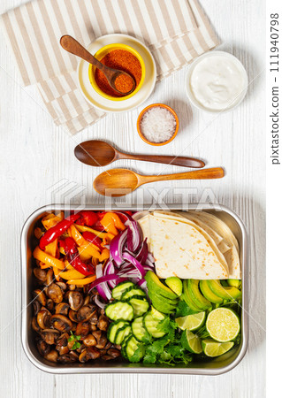 vegan fajitas with mushrooms, veggies on sheet pan vegan fajitas with mushrooms, veggies on sheet pan 111940798