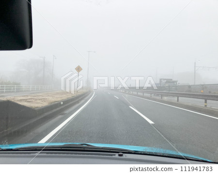 Visibility of a person driving in fog Visibility of a person driving in fog 111941783