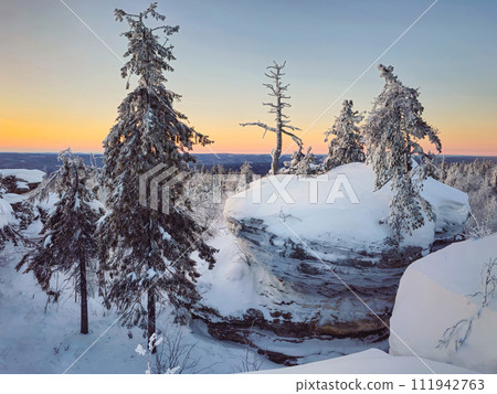 Mystical dawn in the snow-covered mountains. Mystical dawn in the snow-covered mountains. 111942763