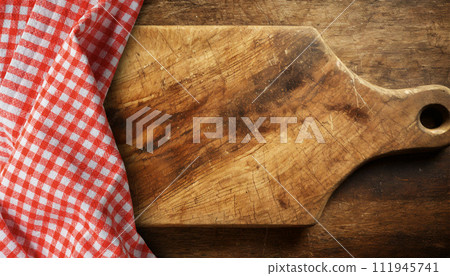 Old Cutting Board with a Checkered Tablecloth and Copy Space - Generative Ai 111945741