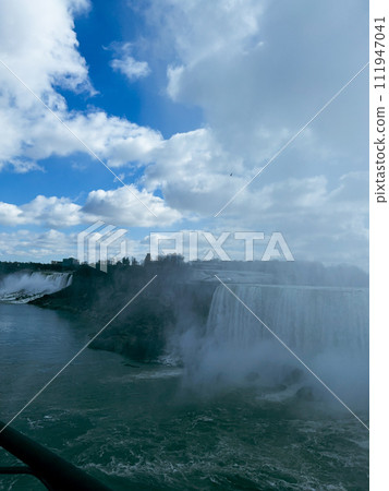 Niagara Falls, Ontario, Canada. Niagara Falls is the largest waterfall in the world. Beautiful view fro the ground near waterfall 111947041