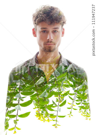 A double exposure male portrait merged with green shoots at the bottom 111947237