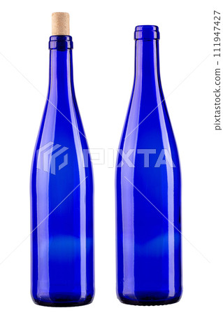 Two blue bottles, one with a cork, the other without isolated on white background.  111947427