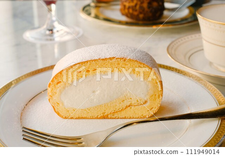 Roll cake on a plate 111949014