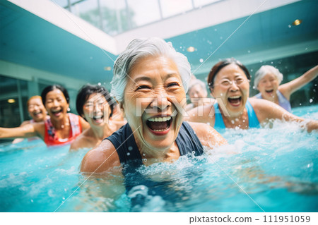 Senior woman exercising in the pool Senior woman exercising in the pool 111951059