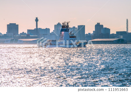 Cityscape of Yokohama, Japan, overlooking the Japan Coast Guard's firefighting ship Hiriyu, which responds to maritime disasters and industrial complex fires. Cityscape of Yokohama, Japan, overlooking the Japan Coast Guard's firefighting ship Hiriyu, which responds to maritime disasters and industrial complex fires. 111951663