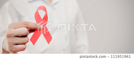 Man holding cancer awareness ribbon 111951961