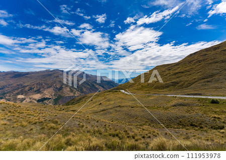 Crown Range Road in New Zealand (panoramic view of Queenstown) Crown Range Road in New Zealand (panoramic view of Queenstown) 111953978