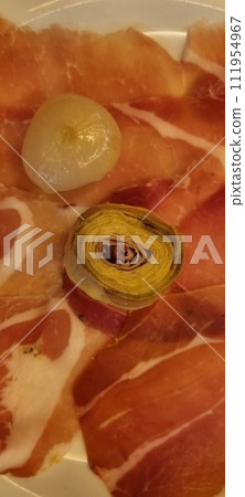 Assorted cured meats and pickles platter Assorted cured meats and pickles platter 111954967