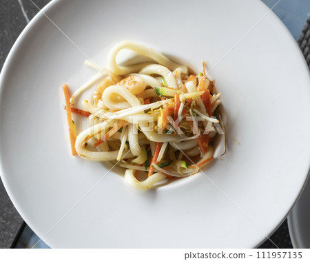 Stir-fried Yaki Udon noodles with shrimps seafood and vegetables over view 111957135