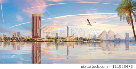 Cairo downtown panorama, pyramids, nile and the skyscrappers, Egypt Cairo downtown panorama, pyramids, nile and the skyscrappers, Egypt 111958478