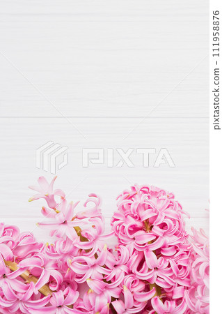 8 March greeting card. mother's day, International Women's Day congratulate Holiday background celebration concept. Pink hyacinth bouquet on white wooden background. Copy space 111958876
