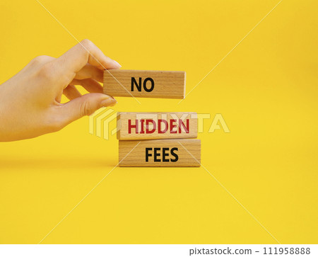 No hidden fees symbol. Concept word No hidden fees on wooden blocks. Businessman hand. Beautiful yellow background. Business and No hidden fees concept. Copy space 111958888