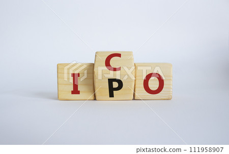 ICO and IPO symbol. Wooden cubes with words ICO - initial coin offering and IPO - initial public offering. Beautiful white background. Business concept. Copy space 111958907