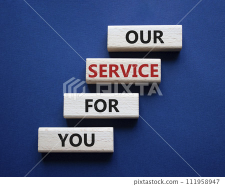 Our service for you symbol. Wooden blocks with words Our service for you. Beautiful deep blue background. Business and Our service for you concept. Copy space. 111958947
