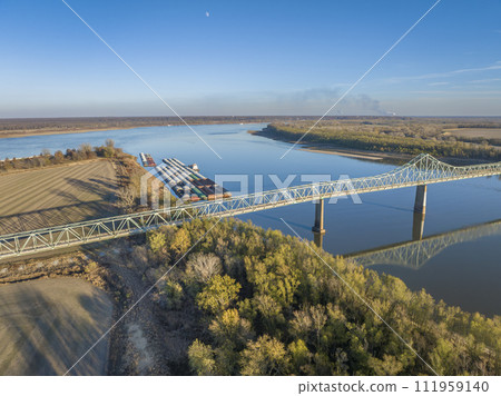 bridge and barges on the Mississippi  River at confluence with the Ohio River below Cairo, IL, November aerial view 111959140