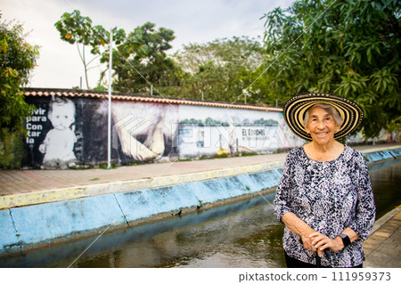 Senior woman tourist at the Macondo Linear Park in Aracataca the birthplace of the Colombian Literature Nobel Prize Gabriel Garcia Marquez 111959373