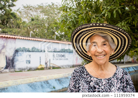 Senior woman tourist at the Macondo Linear Park in Aracataca the birthplace of the Colombian Literature Nobel Prize Gabriel Garcia Marquez 111959374