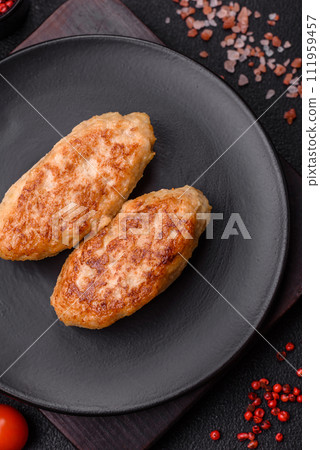 Delicious fresh fried minced fish cutlets with spices and herbs Delicious fresh fried minced fish cutlets with spices and herbs 111959457