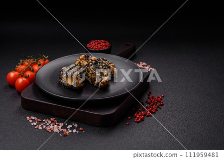 Delicious fresh crispy chicken or fish nuggets on a dark concrete background 111959481