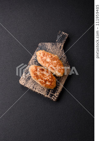Delicious fresh fried minced fish cutlets with spices and herbs Delicious fresh fried minced fish cutlets with spices and herbs 111959485