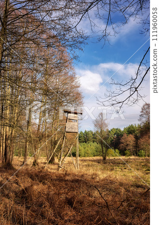 Photo of an elevated deer hunting blind by the woods. Photo of an elevated deer hunting blind by the woods. 111960058