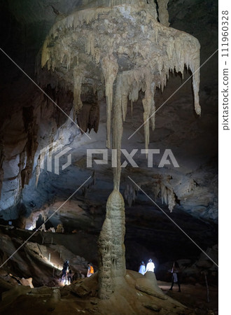 Tourists excited by union of stalactites and stalagmites in Lamp Union. 111960328