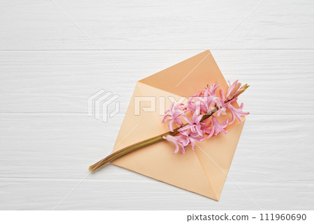 8 March greeting card. mother's day, International Women's Day congratulate Holiday background celebration concept. Pink hyacinth bouquet and envelope on white background. Mockup copy space 111960690