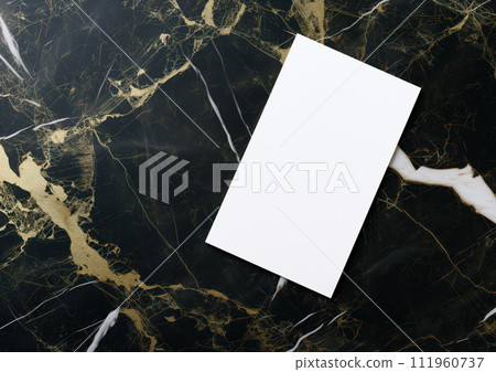 Advertising close up mockup shot of white flyer oblong shape lies on black-golden marble coffee table 111960737