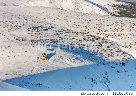 Winter morning , view from Snezka to Silesian house, krkonose mountains. Snezka is mountain on the border between Czech Republic and Poland. 111962086