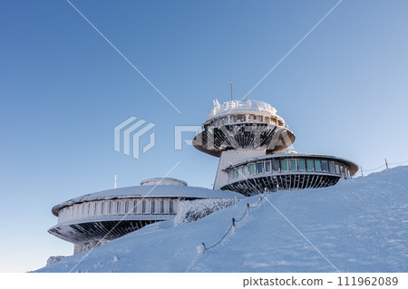 Winter morning, disc shaped meteorological observatory in snezka, mountain on the border between Czech Republic and Poland. 111962089