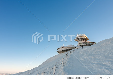Winter morning, disc shaped meteorological observatory in snezka, mountain on the border between Czech Republic and Poland. 111962092