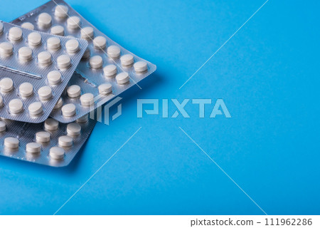 Pharmacy theme, white medicine tablets antibiotic pills. 111962286