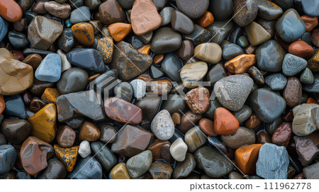Colorful pebble texture for background, small stones in varying shades, colored beach stones Colorful pebble texture for background, small stones in varying shades, colored beach stones 111962778