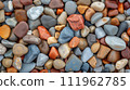 Colorful pebble texture for background, small stones in varying shades, colored beach stones 111962785