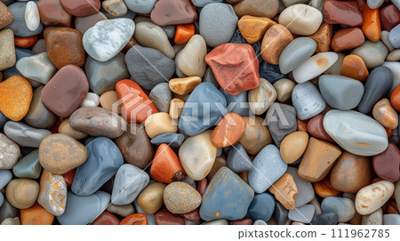 Colorful pebble texture for background, small stones in varying shades, colored beach stones Colorful pebble texture for background, small stones in varying shades, colored beach stones 111962785