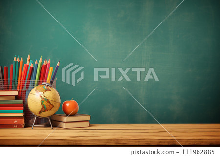 Educational tools on a desk against a chalkboard, back to schoo 111962885