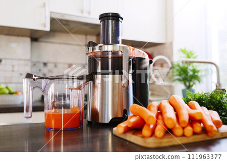 Fresh Carrot Juice Preparation at Home 111963377