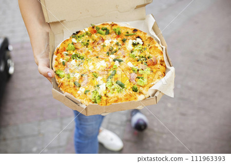 Hand Holding Open Vegetarian Pizza Box 111963393