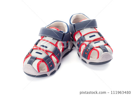 Pair of blue childrens sandals shoes isolated on white background 111963480