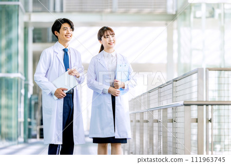 Men and women in white coats Men and women in white coats 111963745
